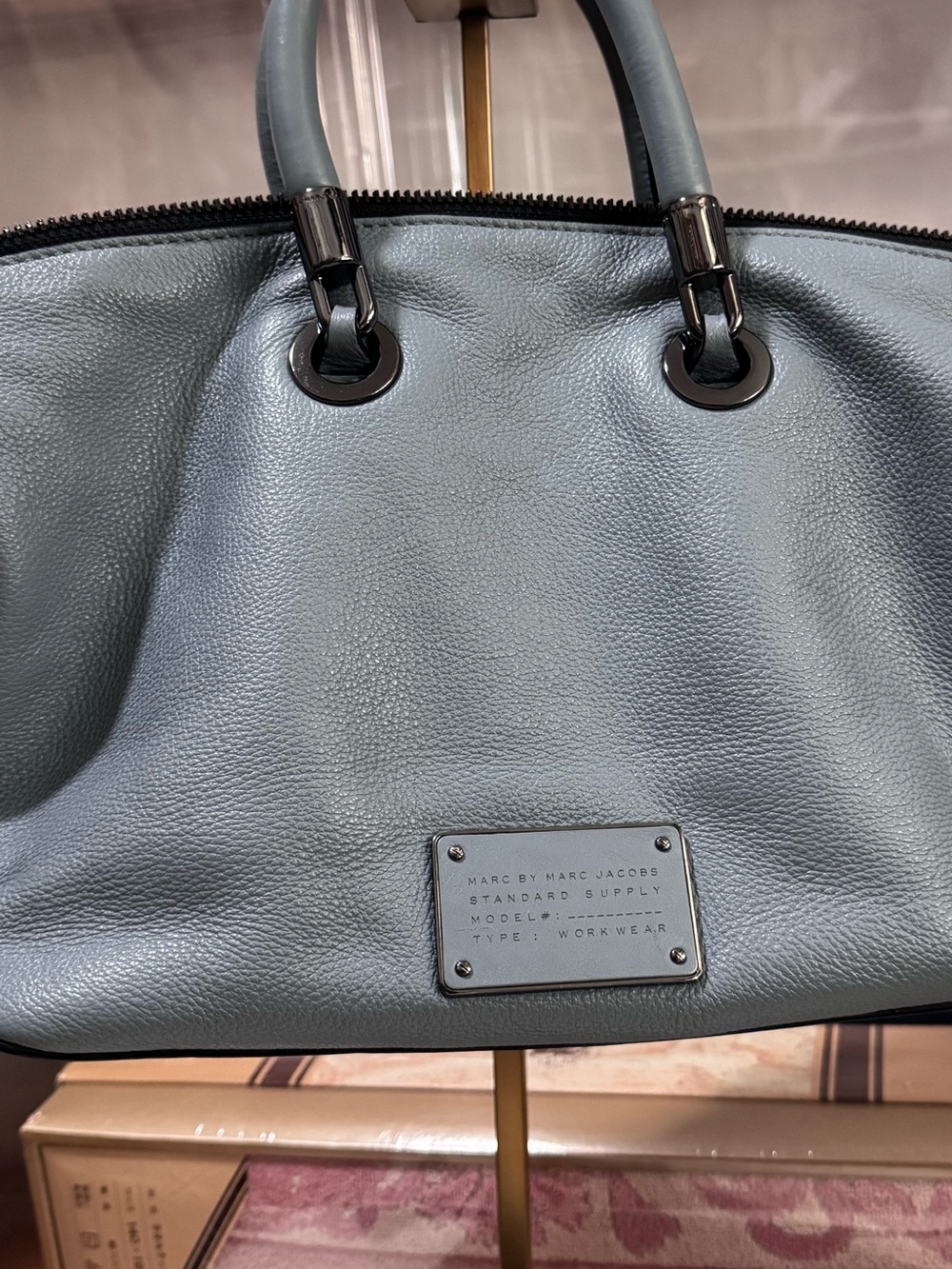 Marc by Marc Jacobs Light Blue Leather hand Bag with strap
12"W x 8"L